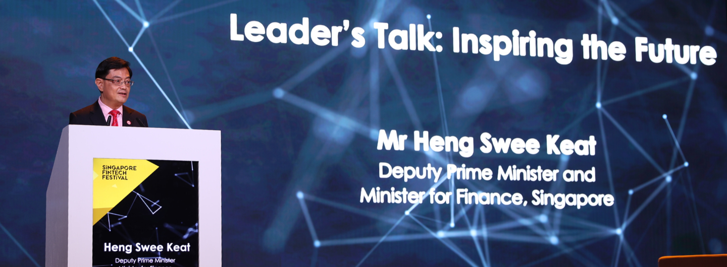 Mr. Heng Swee Keat at Singapore Fintech Festival podium in front of "Leader's Talk: Inspiring the Future."